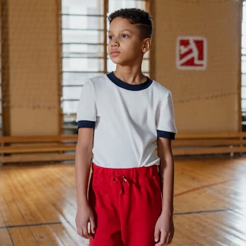 boy standing in gym